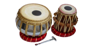 TABLA - The tabla is a two drum percussion instrument that looks similar to the Jori and provides beat or rhythm to the music that is being sung. Playing the tabla involves extensive use of the fingers, and the palm is used in a sliding action or by exerting pressure, to create a wide array of sounds, varying pitch, and different speeds can be played to help complete the musical piece being sung.