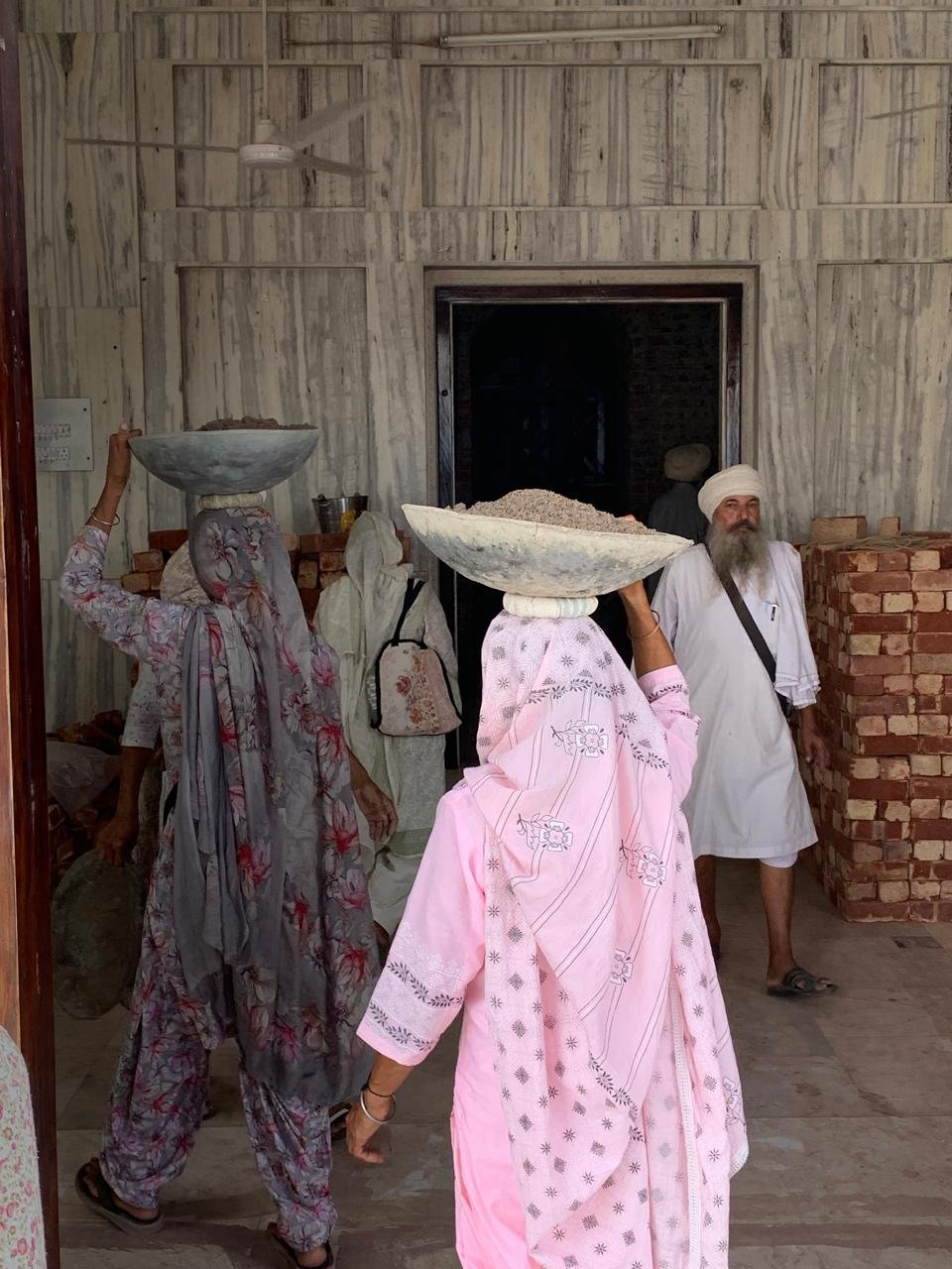 Sevadars offering seva at Janam Asthan